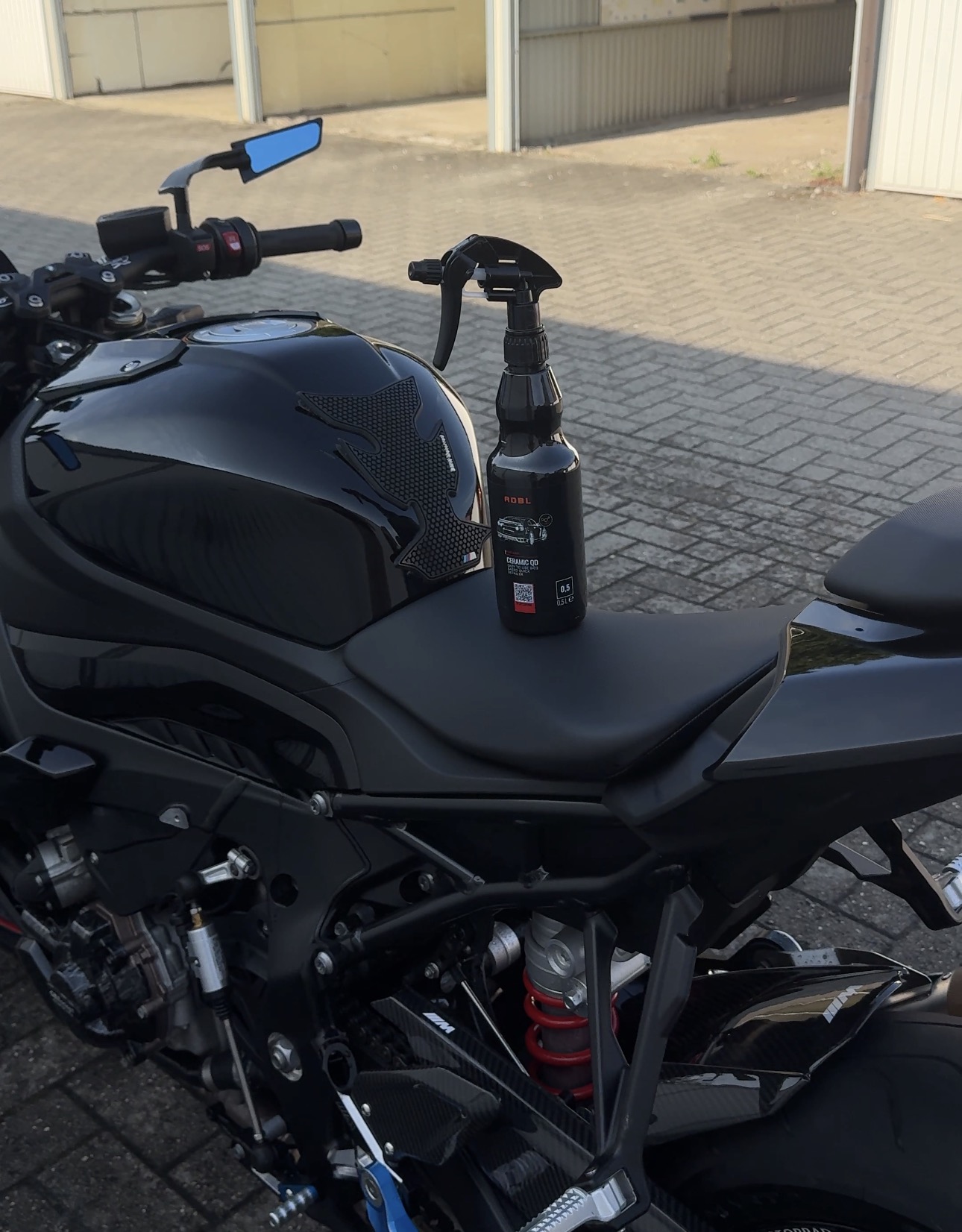 ADBL Ceramic QD beside a detailed BMW motorcycle