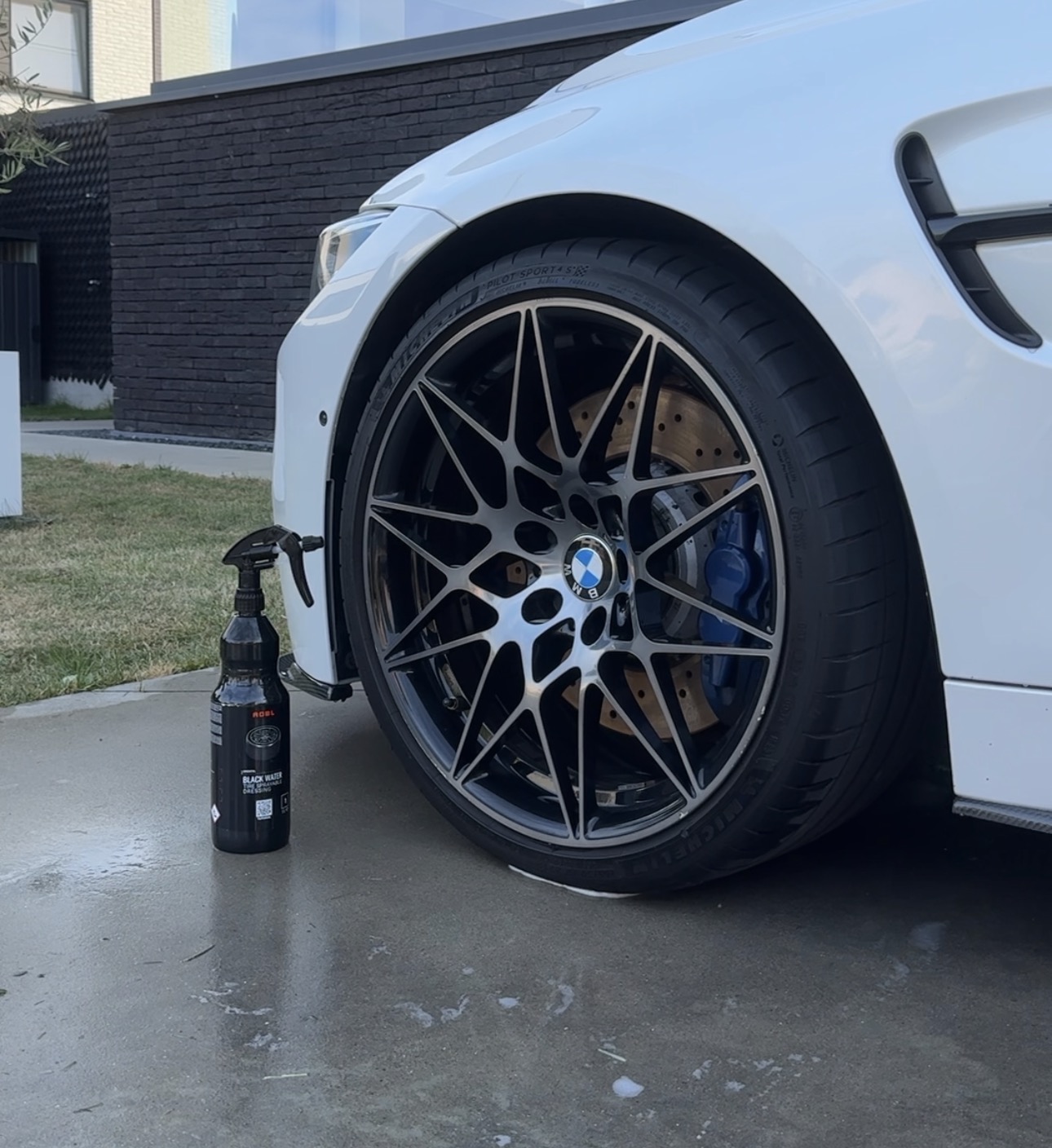 ADBL Black Water beside a detailed BMW wheel